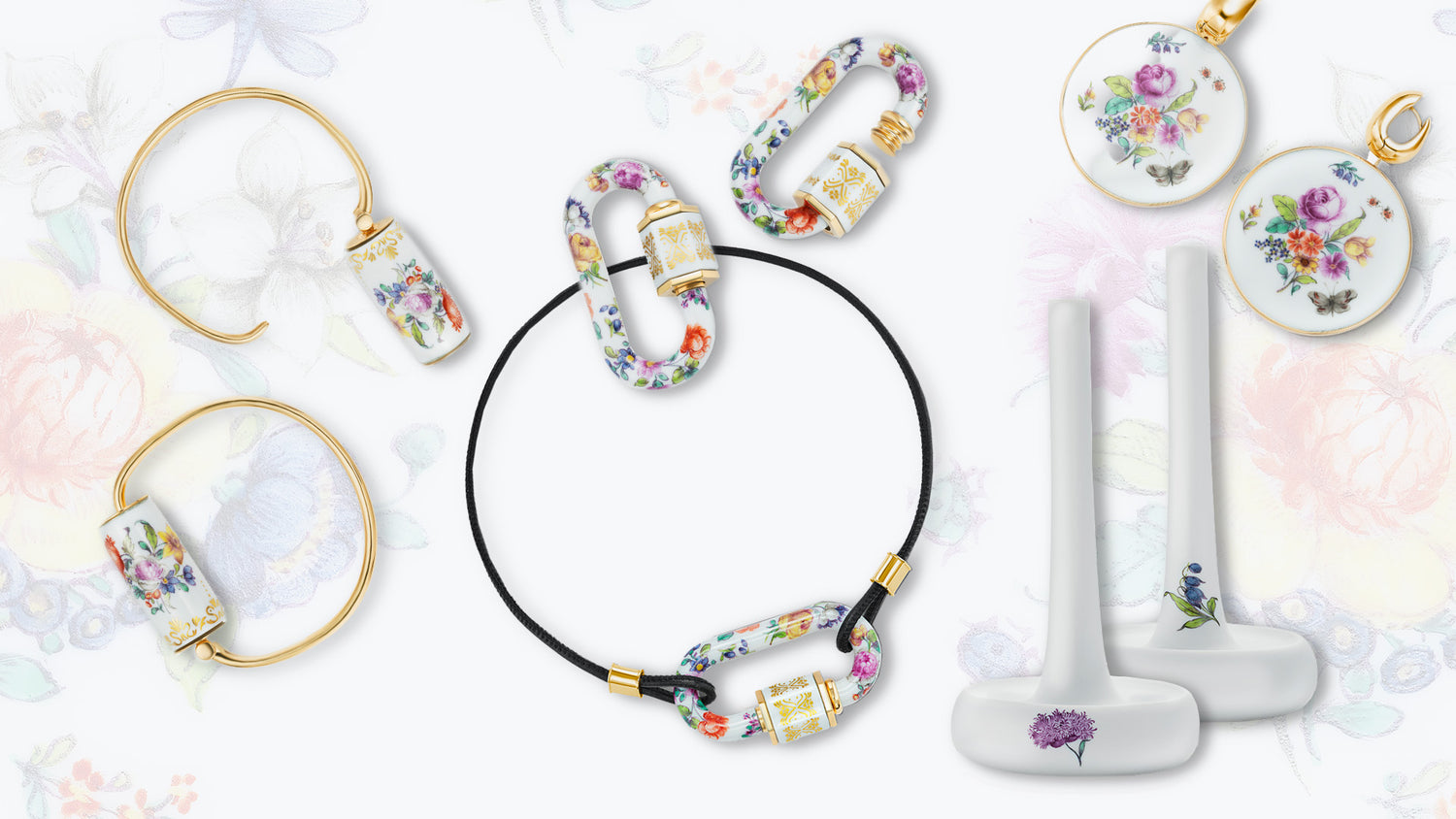 Produktszene: Marla-Aaron × Nymphenburg Schmuckarrangement – handbemalte Porzellan-Locks mit goldenen Beschlägen, zwei Armreifen, ein schwarzes Kordelarmband, zwei runde Porzellananhänger und zwei weiße Ringständer mit kleinen Blumenmotiven vor zarter Blumenhintergrundgrafik.


Product scene: Marla-Aaron × Nymphenburg jewellery arrangement—hand-painted porcelain locks with gold fittings, two bangles, a black cord bracelet, two round porcelain pendants, and two white ring stands with small flor